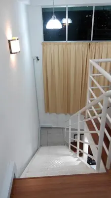 a staircase leading to a window in a room at CEO SoHo Suite - biz or holiday 2-5 Pax in Bayan Lepas