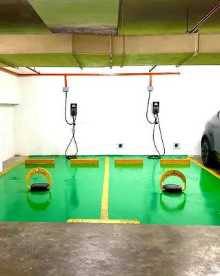a gym with a green floor with yellow lines on it at One Pacific Hotel and Serviced Apartments in George Town