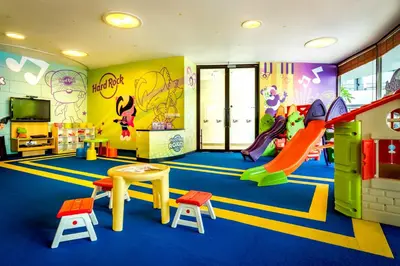 a childrens play room with a slide and a slide at Hard Rock Hotel Penang in Batu Ferringhi