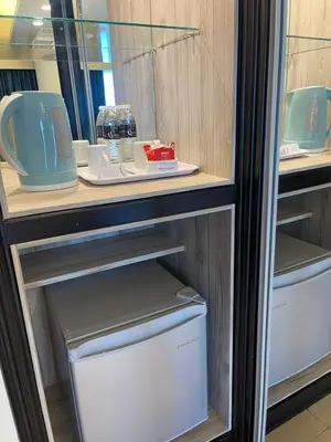 an open refrigerator with a white freezer and a drawer at Flamingo Hotel by the Beach, Penang in George Town