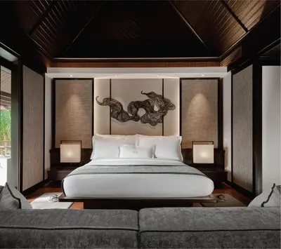 a bedroom with a large bed and a couch at Pangkor Laut Resort - Small Luxury Hotels of the World in Pangkor