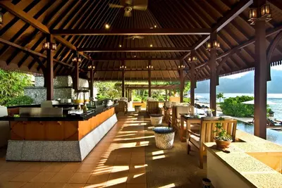 a restaurant with a view of the ocean at Pangkor Laut Resort - Small Luxury Hotels of the World in Pangkor