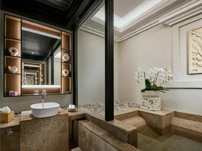 a bathroom with a sink and a mirror at Pangkor Laut Resort - Small Luxury Hotels of the World in Pangkor