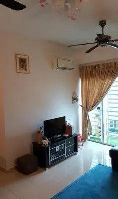 a living room with a flat screen tv sitting on a table at Sweet Homestay Penang in Bayan Lepas