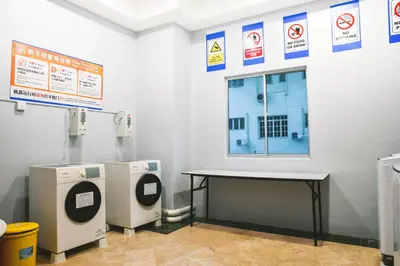 a room with a table and some signs on the wall at Leisure Cove Hotel and Apartments in George Town