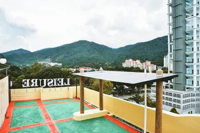 a view of the mountains from the balcony of a building at Leisure Cove Hotel and Apartments in George Town