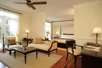 a living room with a couch and a bed at Cameron Highlands Resort - Small Luxury Hotels of the World in Cameron Highlands