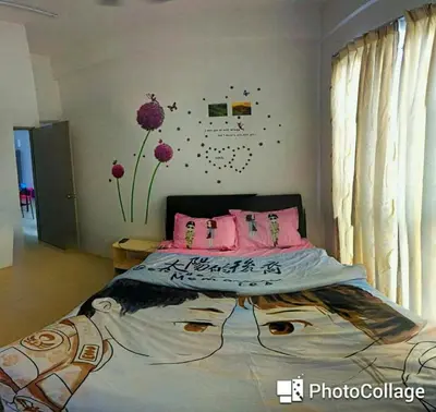 a bedroom with a large bed with pink pillows at Famous night market Cameron Highlands Nearby in Cameron Highlands