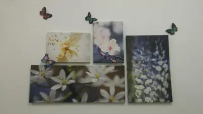 three pictures of flowers and butterflies on a wall at Famous night market Cameron Highlands Nearby in Cameron Highlands