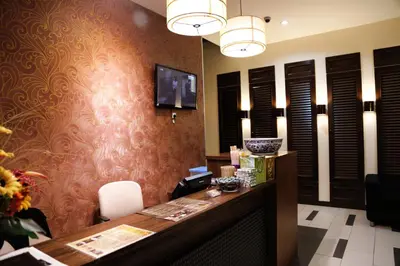 a lobby with a reception desk in a hotel room at Garden Inn, Penang in George Town