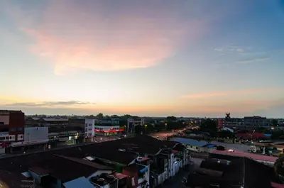 a view of a city at sunset at Mornington Hotel Medan Ipoh in Ipoh