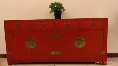 a red cabinet with a potted plant on top of it at Marina Oriental Hotel in Butterworth
