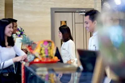 a group of people standing in a room at Vouk Hotel Suites, Penang in George Town