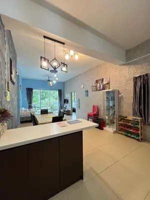 a kitchen and living room with a large counter top at Cameron Forest Home - Golden Hills in Cameron Highlands