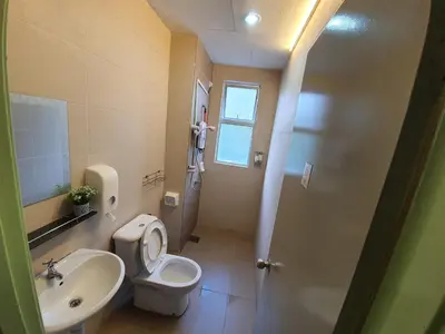 a small bathroom with a toilet and a sink at Cameron Forest Home - Golden Hills in Cameron Highlands