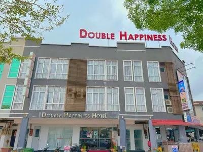 a building with a sign that reads double happiness at Double Happiness Hotel in Seri Manjung