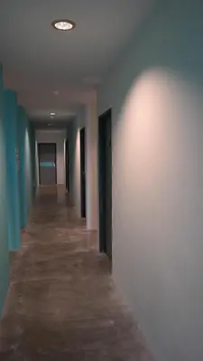 an empty hallway of an office building with a long corridor at Clover Hotel Ipoh in Ipoh