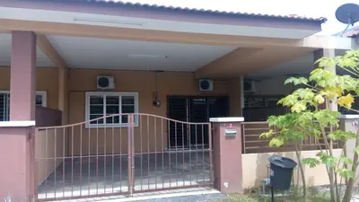 a house with a gate in front of it at Taiping Valuable Homestay in Taiping