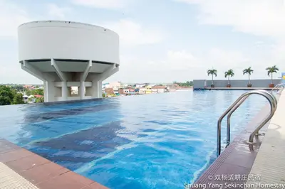 a swimming pool on the roof of a building at Shuang Yang Sekinchan Homestay in Sekincan