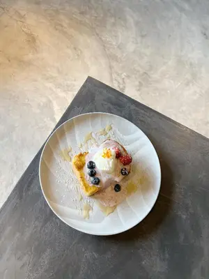 a paper plate with a piece of food on it at Vvip Hotel in Hutan Melintang