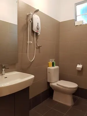 a bathroom with a toilet and a sink and a shower at MY CHINAMAN'S HOME II in George Town
