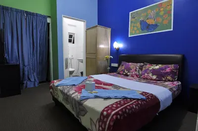 a bedroom with a bed with towels on it at Orchid Haven in Cameron Highlands