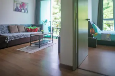a living room with a couch and a table at Strawberry Homestay in Cameron Highlands