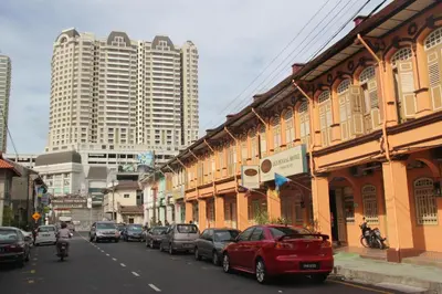 a street with cars parked on the side of a building at Old Penang Hotel - Trang Road in George Town