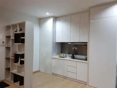 a kitchen with white cabinets and a counter top at 118 Suite in George Town