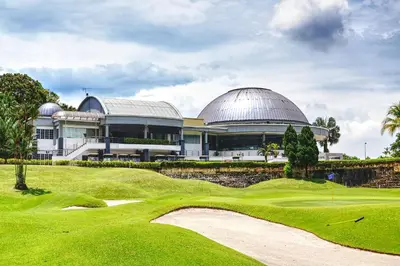 a view of a golf course with a building at Meru Suites at Meru Valley Resort in Ipoh