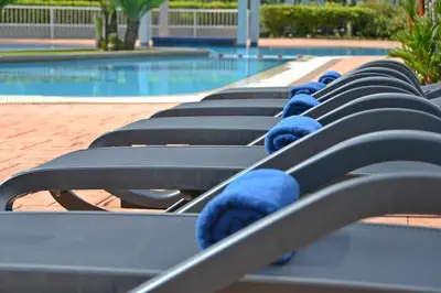 a row of benches with blue teddy bears on them at Meru Suites at Meru Valley Resort in Ipoh