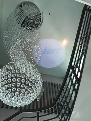 a large glass chandelier hanging from a ceiling at Purest Hotel Sungai Petani in Sungai Petani