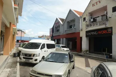 a group of cars parked on a city street at Brezza Hotel Lumut in Lumut