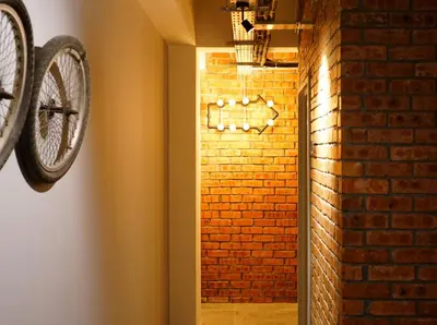 a room with a brick wall and a bike on the wall at Brick Box Hotel @ Oldtown Ipoh in Ipoh