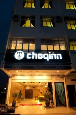 a building with a sign on the front of it at Hotel Cheqinn in Ipoh