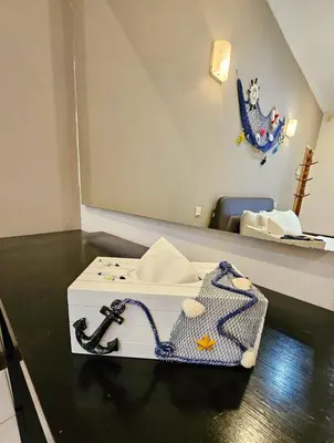 a white box on a counter with a bag on it at Little Heaven by Sky Hive, A Beach Front Bungalow in Tanjung Bungah