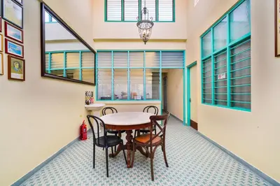 a dining room with a table and chairs at Dream & Wander Homestay in Ipoh