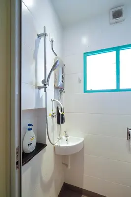 a bathroom with a shower and a sink at Dream & Wander Homestay in Ipoh