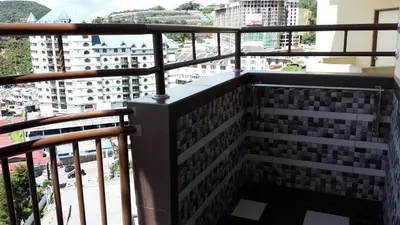 a balcony with a view of a city at Lacy's Crown Imperial Court Apartment in Cameron Highlands