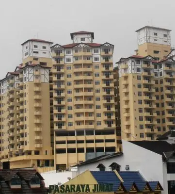 a group of tall buildings in a city at Lacy's Crown Imperial Court Apartment in Cameron Highlands