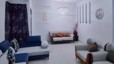 a living room with two couches and a couch at Shamrock Villas Corner OR Seaview OR Standard in Batu Ferringhi