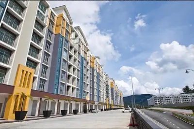 a row of tall buildings on a city street at Dephane Apartment in Cameron Highlands