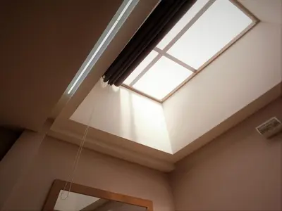 a skylight in a living room with a window at Royale Hotel Batu Gajah in Ipoh