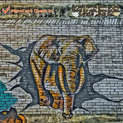 a painting of a tiger on a brick wall at Royale Hotel Batu Gajah in Ipoh