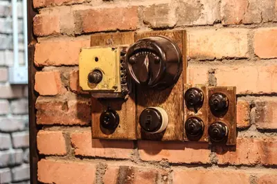 an electrical outlet on a brick wall at Rock Wood Hotel in Sungai Petani