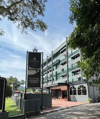 a large building with a sign in front of it at Hotel Waterfall in George Town