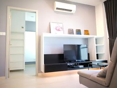 a living room with a tv and a couch at Penang Studio Suite in Georgetown in George Town