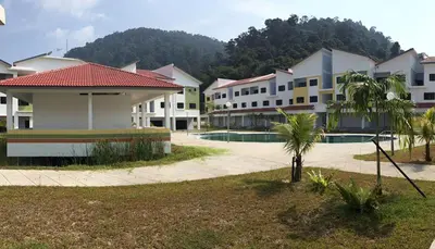 a row of apartment buildings with a courtyard at Pangkor Lot 10 Vacation Studio in Pangkor