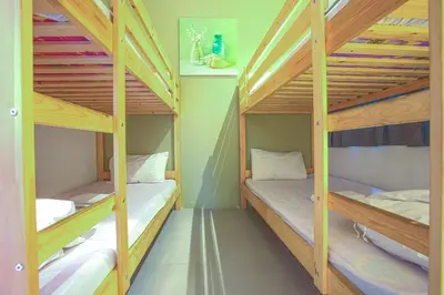 two bunk beds in a small room with at DreamScape Apartment @ Golden Hill in Cameron Highlands