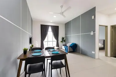 a dining room with a table and chairs at DreamScape Apartment @ Golden Hill in Cameron Highlands
